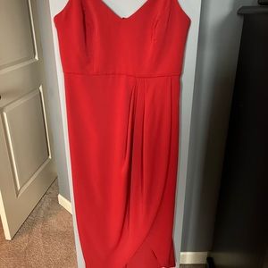 Mid length red dress.